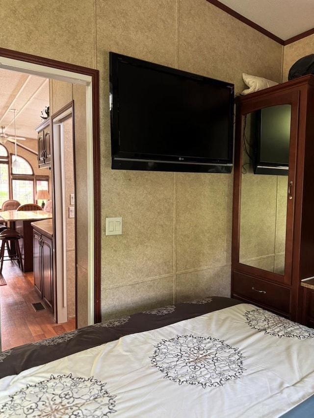 463 Aspen Way, Edgerton, WI 53534 - bedroom featuring wood finished floors and ornamental molding