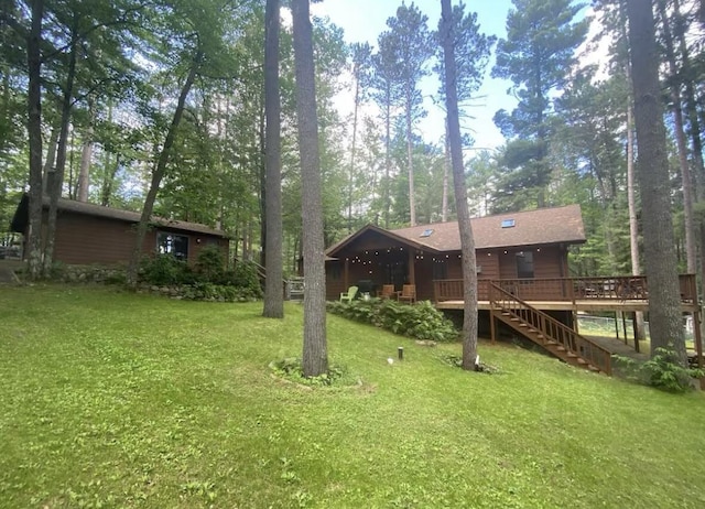 N11894 E Deer Lake Rd, Tomahawk, WI 54487 - view of green lawn featuring stairway and a wooden deck