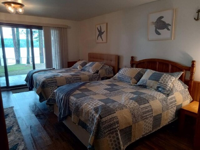 N11894 E Deer Lake Rd, Tomahawk, WI 54487 - bedroom with access to outside and wood finished floors