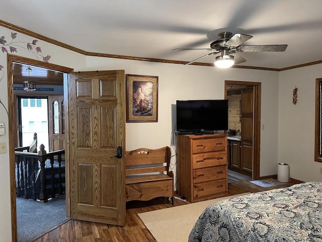 N11894 E Deer Lake Rd, Tomahawk, WI 54487 - bedroom with dark wood-style flooring, ornamental molding, and a ceiling fan