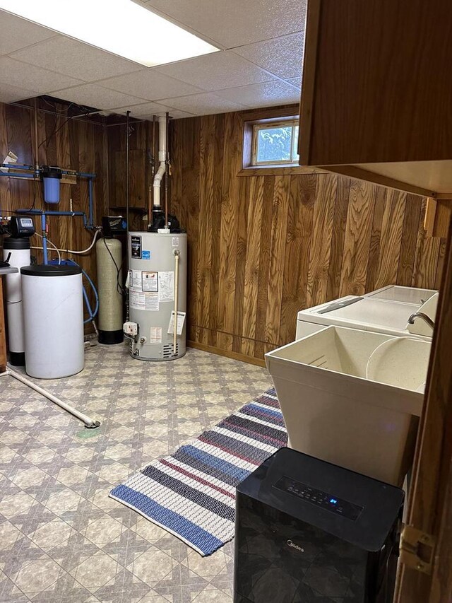 N11894 E Deer Lake Rd, Tomahawk, WI 54487 - basement with water heater, light floors, wood walls, washer / clothes dryer, and a water softener system