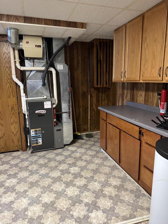 N11894 E Deer Lake Rd, Tomahawk, WI 54487 - finished below grade area with light floors, heating unit, and wood walls