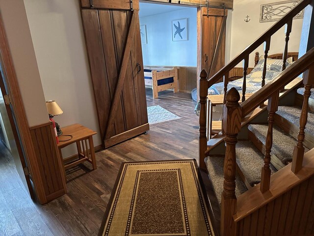 N11894 E Deer Lake Rd, Tomahawk, WI 54487 - staircase with a barn door and wood finished floors