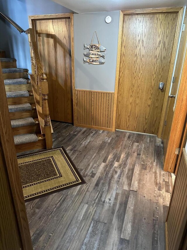 N11894 E Deer Lake Rd, Tomahawk, WI 54487 - foyer entrance with wood finished floors, stairway, wainscoting, and wooden walls