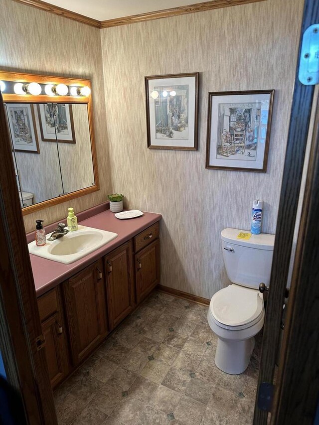 N11894 E Deer Lake Rd, Tomahawk, WI 54487 - bathroom featuring toilet, baseboards, and vanity