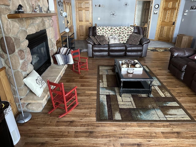 N11894 E Deer Lake Rd, Tomahawk, WI 54487 - living room featuring wood finished floors and a stone fireplace