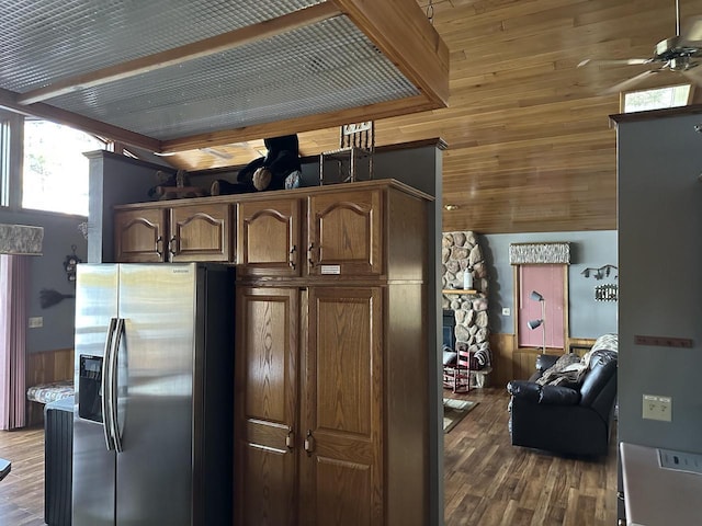 N11894 E Deer Lake Rd, Tomahawk, WI 54487 - kitchen featuring stainless steel fridge with ice dispenser, a ceiling fan, wood finished floors, and wood walls