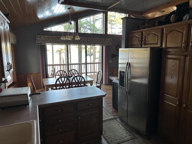 N11894 E Deer Lake Rd, Tomahawk, WI 54487 - kitchen featuring stainless steel fridge, a chandelier, light countertops, lofted ceiling, and plenty of natural light