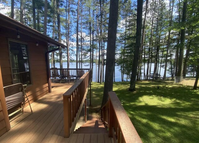 N11894 E Deer Lake Rd, Tomahawk, WI 54487 - deck featuring a water view and a lawn
