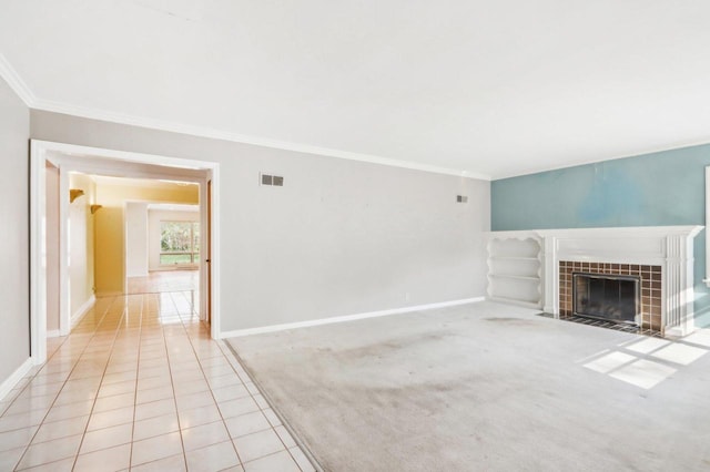 7700 3rd Ave, Kenosha, WI 53143 - unfurnished living room featuring crown molding, a fireplace, baseboards, and tile patterned floors