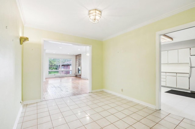 7700 3rd Ave, Kenosha, WI 53143 - spare room featuring baseboards, crown molding, and light tile patterned floors