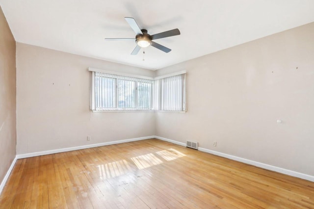 7700 3rd Ave, Kenosha, WI 53143 - empty room with a ceiling fan, baseboards, and wood-type flooring
