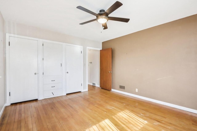7700 3rd Ave, Kenosha, WI 53143 - unfurnished bedroom featuring light wood finished floors, baseboards, and ceiling fan