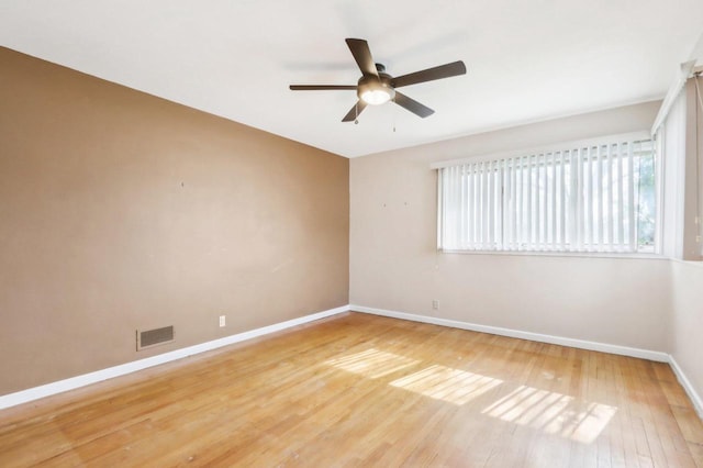 7700 3rd Ave, Kenosha, WI 53143 - empty room featuring baseboards, a ceiling fan, and light wood-type flooring