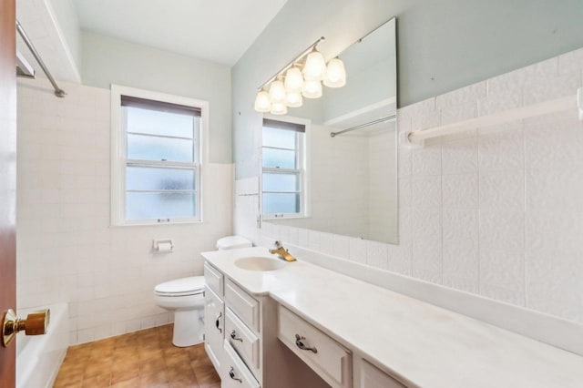 7700 3rd Ave, Kenosha, WI 53143 - full bathroom with tile walls, toilet, vanity, tile patterned flooring, and a wainscoted wall