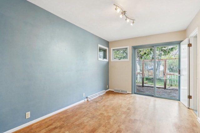 7700 3rd Ave, Kenosha, WI 53143 - unfurnished room featuring baseboards and wood finished floors