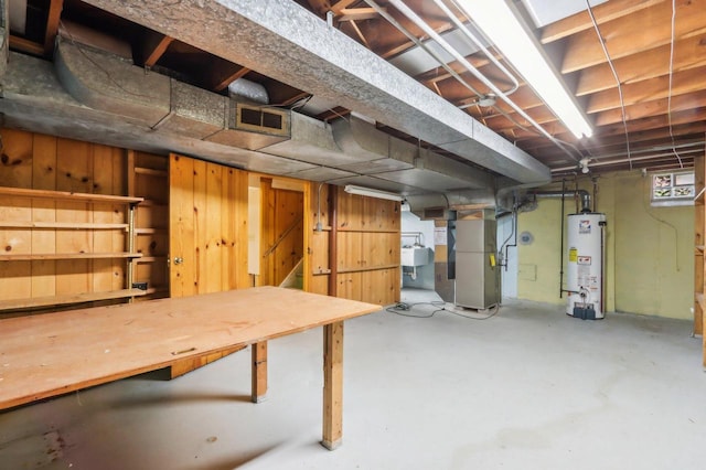 7700 3rd Ave, Kenosha, WI 53143 - basement with gas water heater, heating unit, and a sink