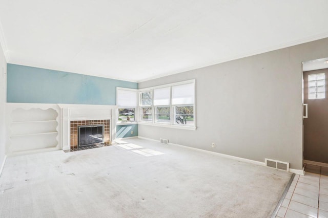 7700 3rd Ave, Kenosha, WI 53143 - unfurnished living room with ornamental molding, a fireplace, baseboards, and tile patterned flooring