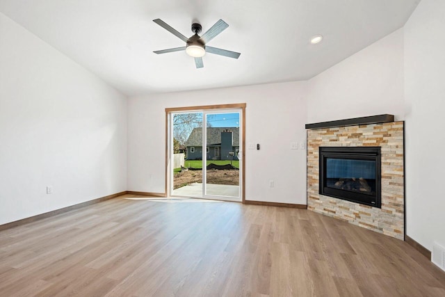 4551 Menasha Ave, Manitowoc, WI 54220 - unfurnished living room with wood finished floors, a ceiling fan, baseboards, a fireplace, and recessed lighting