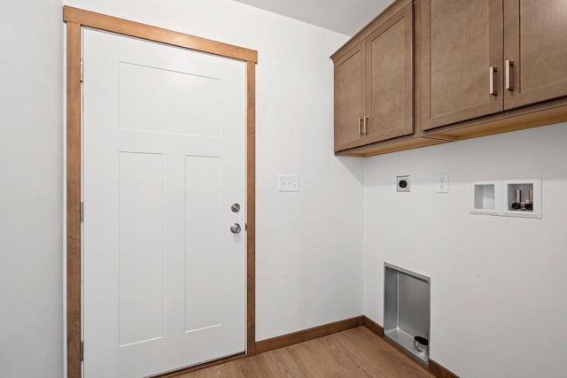 4551 Menasha Ave, Manitowoc, WI 54220 - laundry room featuring hookup for an electric dryer, light wood finished floors, cabinet space, hookup for a washing machine, and baseboards
