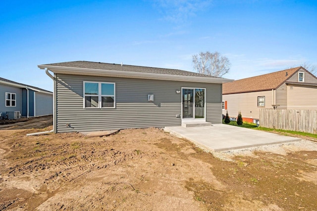 4551 Menasha Ave, Manitowoc, WI 54220 - back of house featuring a patio, central AC unit, and fence