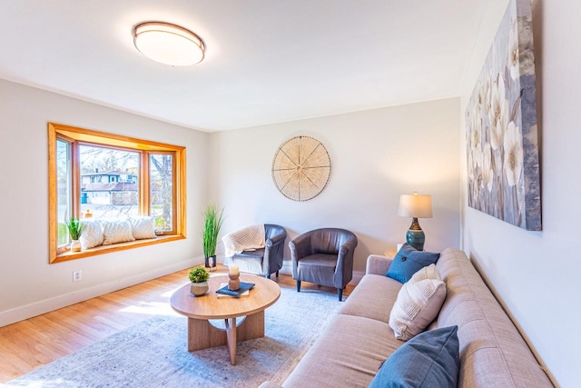 living room with wood finished floors and baseboards