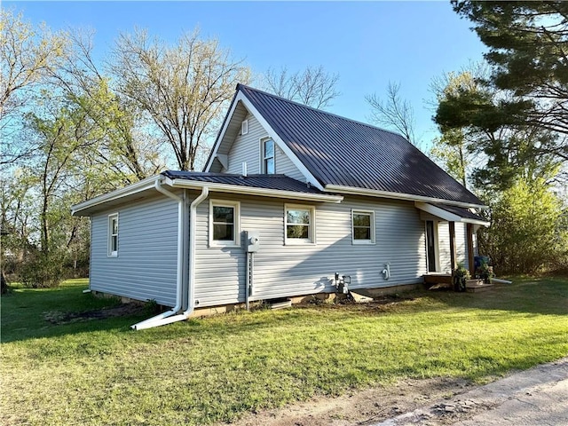 208 N 7th St, Cameron, WI 54822 - view of side of property with metal roof, a lawn, and a standing seam roof