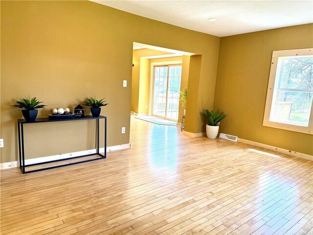 208 N 7th St, Cameron, WI 54822 - spare room featuring light wood-style floors and baseboards