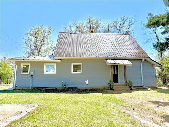 208 N 7th St, Cameron, WI 54822 - view of front of home with a front yard and metal roof