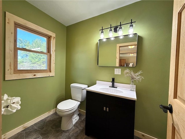 208 N 7th St, Cameron, WI 54822 - bathroom featuring baseboards, toilet, and vanity