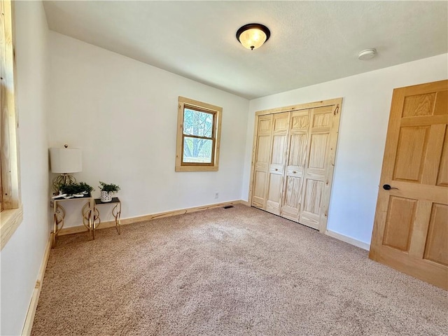 208 N 7th St, Cameron, WI 54822 - unfurnished bedroom with carpet, baseboards, and a closet