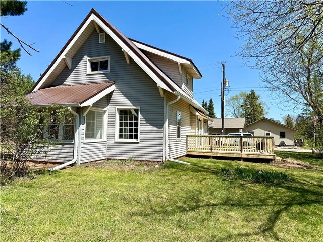 208 N 7th St, Cameron, WI 54822 - back of house with a deck and a yard