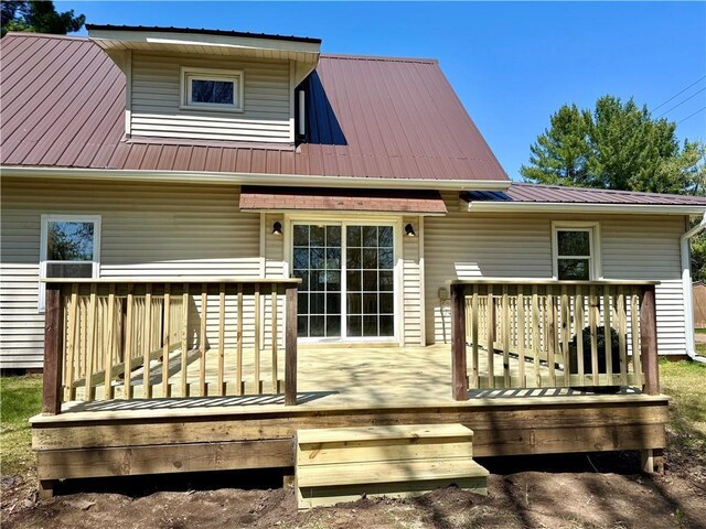 208 N 7th St, Cameron, WI 54822 - back of house featuring a wooden deck and metal roof