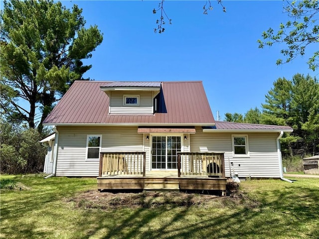 208 N 7th St, Cameron, WI 54822 - rear view of house featuring a lawn, a wooden deck, and metal roof