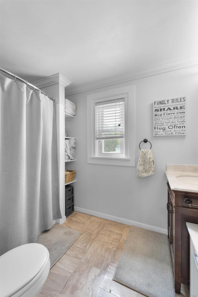1301 Jackson St, Stoughton, WI 53589 - full bath with vanity, toilet, ornamental molding, baseboards, and a shower with curtain