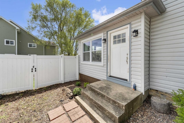 1301 Jackson St, Stoughton, WI 53589 - doorway to property with a gate and fence