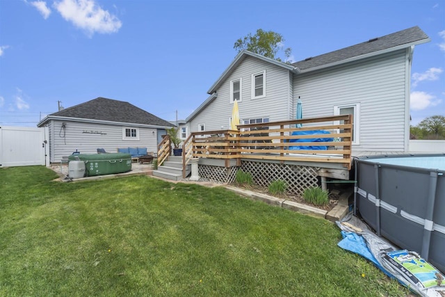 1301 Jackson St, Stoughton, WI 53589 - rear view of house with a deck, a lawn, and a shingled roof