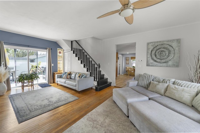 1301 Jackson St, Stoughton, WI 53589 - living room with stairs, wood finished floors, ceiling fan, and ornamental molding