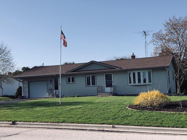 508 Roosevelt Ave, Howards Grove, WI 53083 - single story home featuring a garage, a front lawn, asphalt driveway, and a chimney