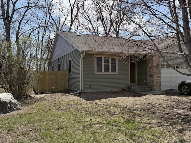 422 Callaway Blvd, La Crosse, WI 54603 - view of front of property featuring a garage, roof with shingles, and fence