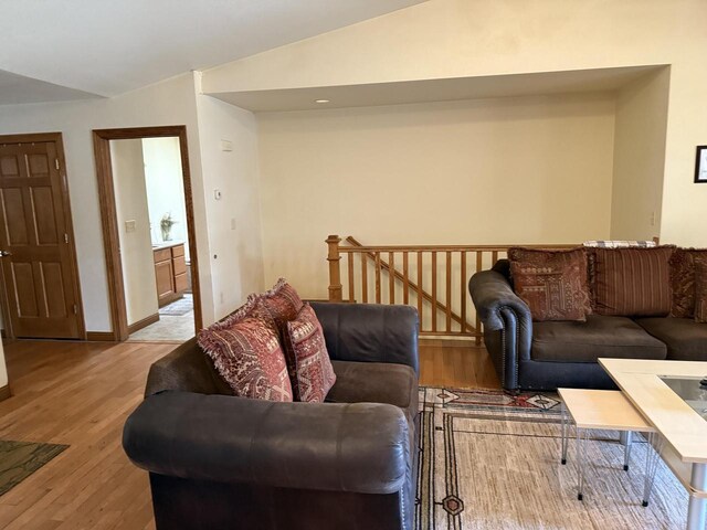 422 Callaway Blvd, La Crosse, WI 54603 - living room with lofted ceiling, light wood-style floors, and baseboards