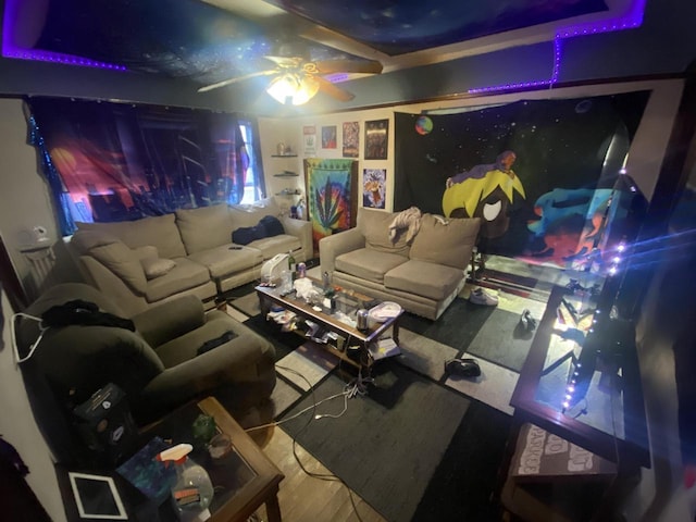 home theater room featuring ceiling fan