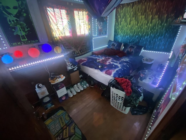 bedroom with wood finished floors