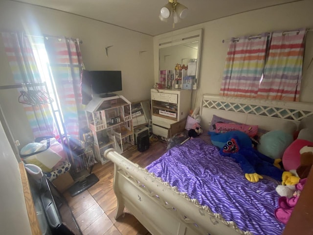 bedroom with wood finished floors