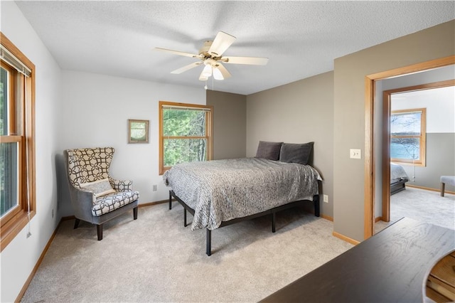 29825 Minerva Cir, Danbury, WI 54830 - carpeted bedroom with a ceiling fan, a textured ceiling, and baseboards