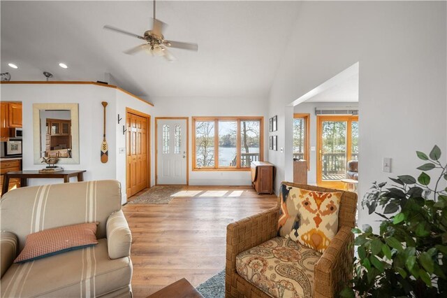 29825 Minerva Cir, Danbury, WI 54830 - living room featuring vaulted ceiling, ceiling fan, recessed lighting, light wood-type flooring, and baseboards