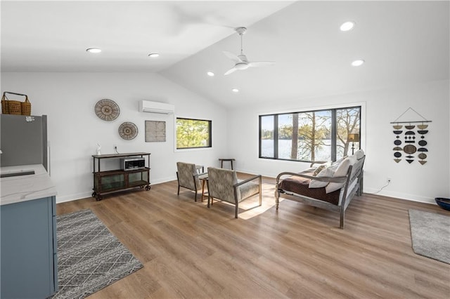 29829 Minerva Cir, Danbury, WI 54830 - living area with a wall mounted air conditioner, a ceiling fan, lofted ceiling, recessed lighting, and light wood-style floors