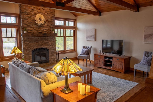 953 Larkspur Rd, Plymouth, WI 53073 - living area featuring hardwood / wood-style floors, healthy amount of natural light, wood ceiling, and a stone fireplace