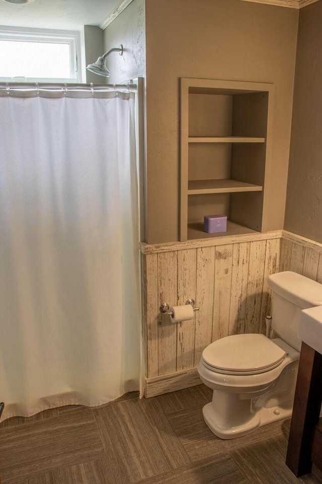 953 Larkspur Rd, Plymouth, WI 53073 - bathroom with toilet, wood walls, wainscoting, and a shower with shower curtain