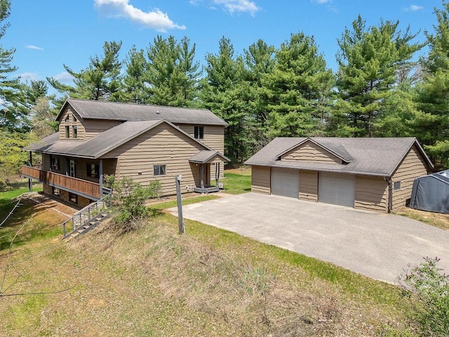E9510 Oak Hill Rd, Wisconsin Dells, WI 53965 - view of front of property with a garage and an outdoor structure